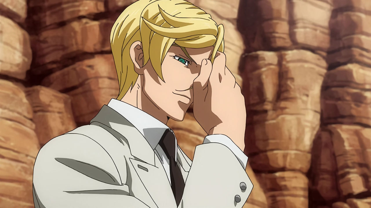 McGillis in a canyon wearing an off-white suit playing with his hair