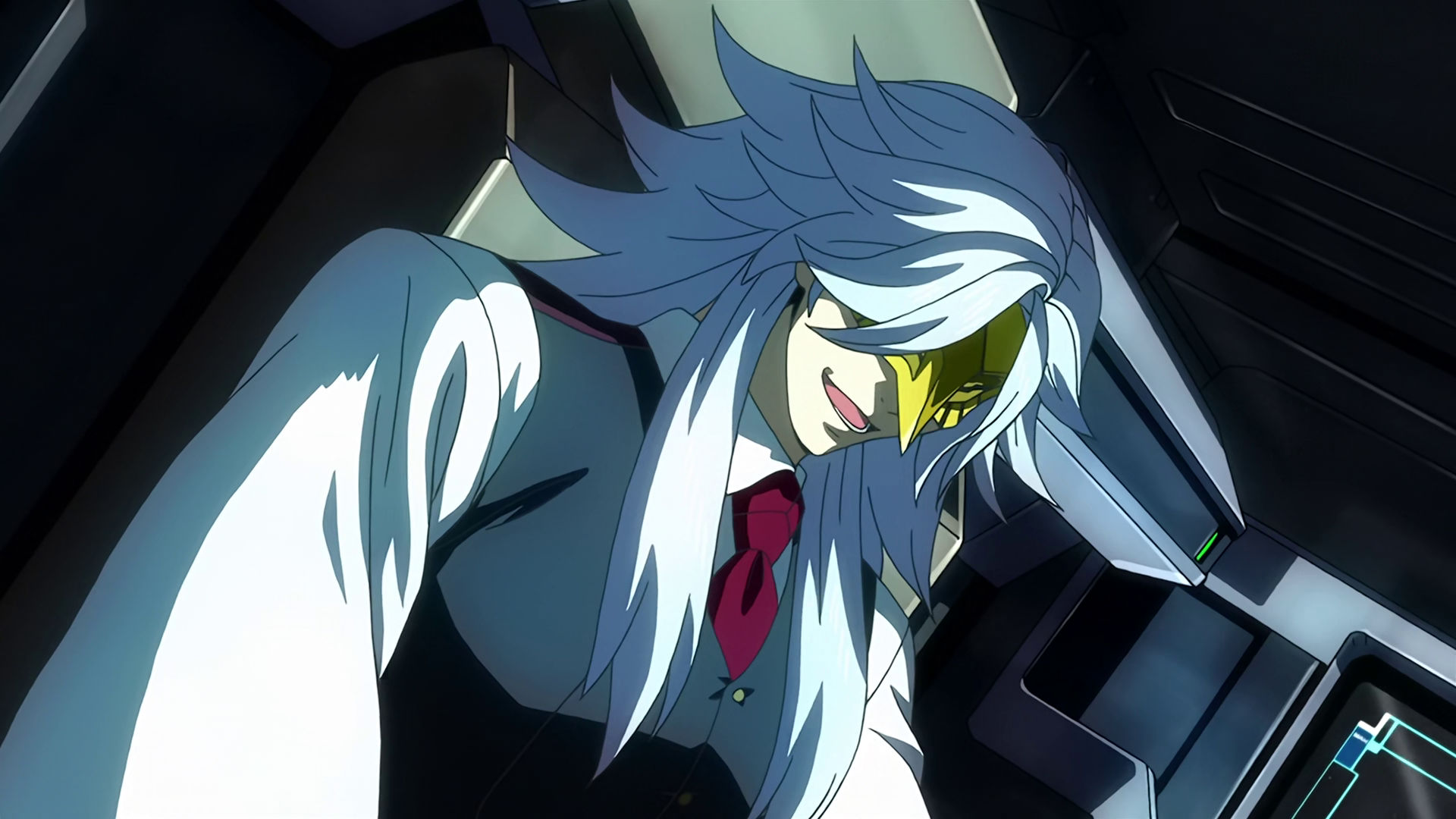 McGillis as Montag inside a mobile suit cockpit, he is laughing.