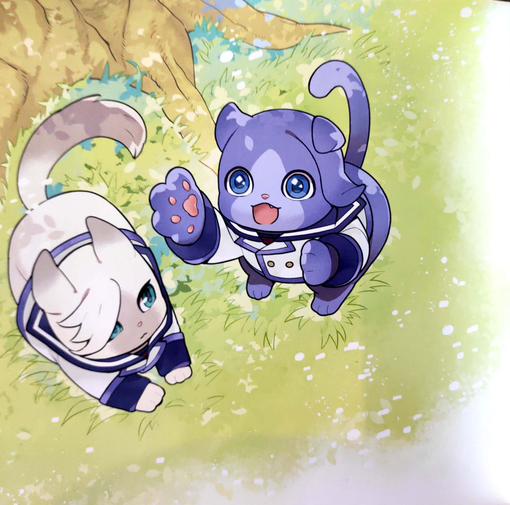 Cat McGillis and Gaelio, McGillis is laying down next to a tree and Gaelio is reaching up with one of his paws.