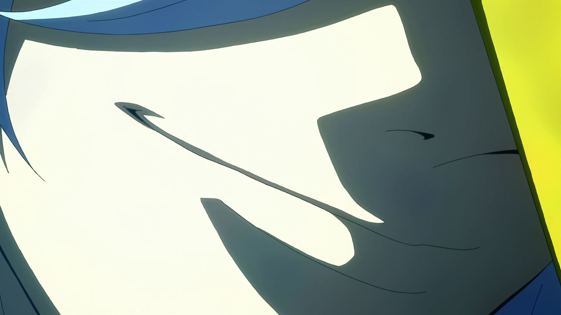A closeup of McGillis face wearing Montag's mask, he's smiling.