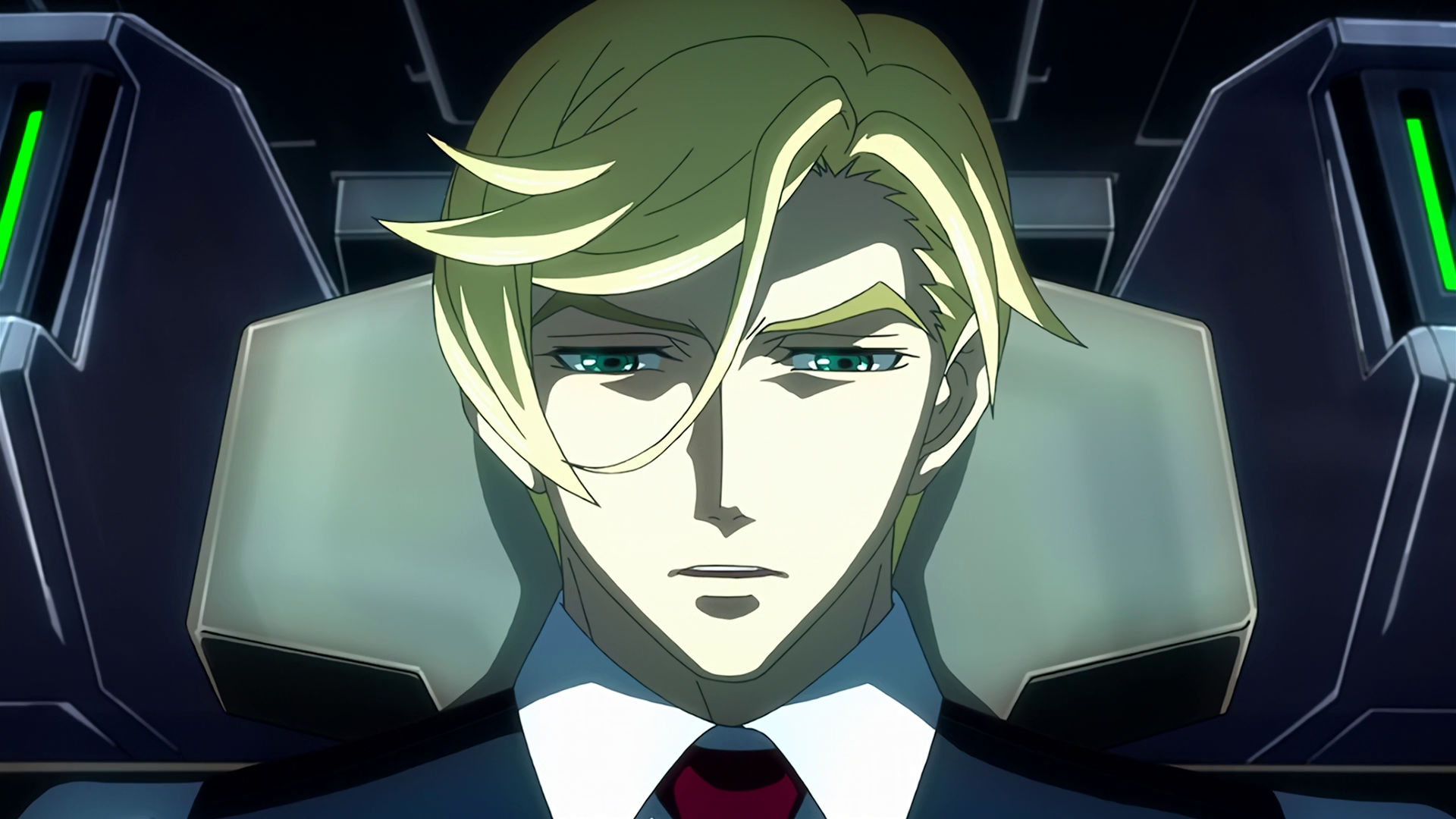 McGillis inside a mobile suit cockpit, he looks sad.