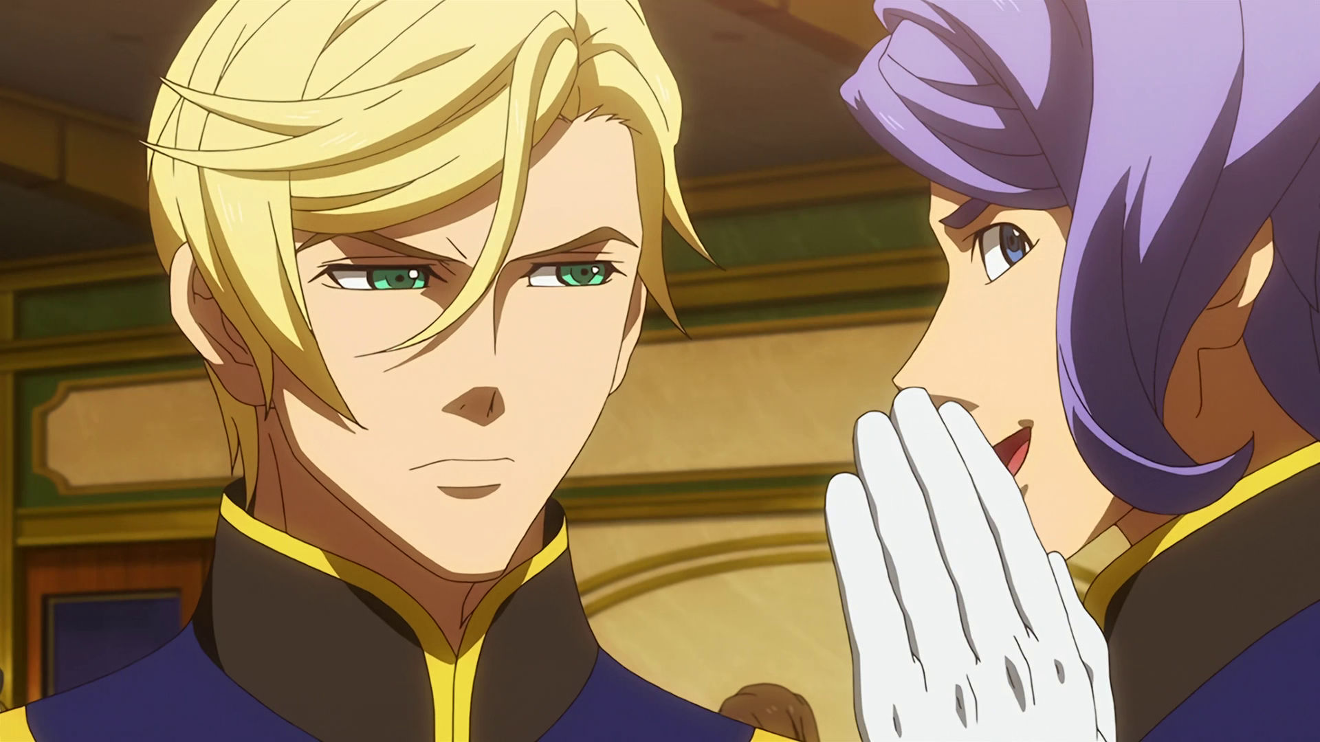 Gaelio happily whispering something to McGillis who looks annoyed.