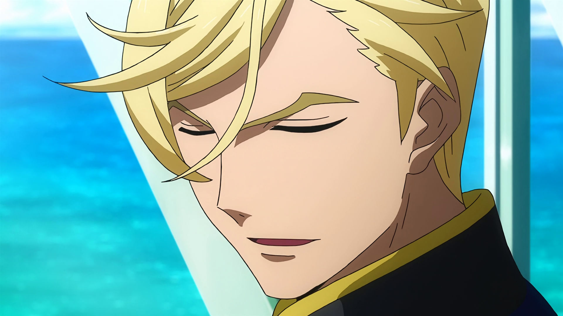 McGillis smiling with his eyes closed.