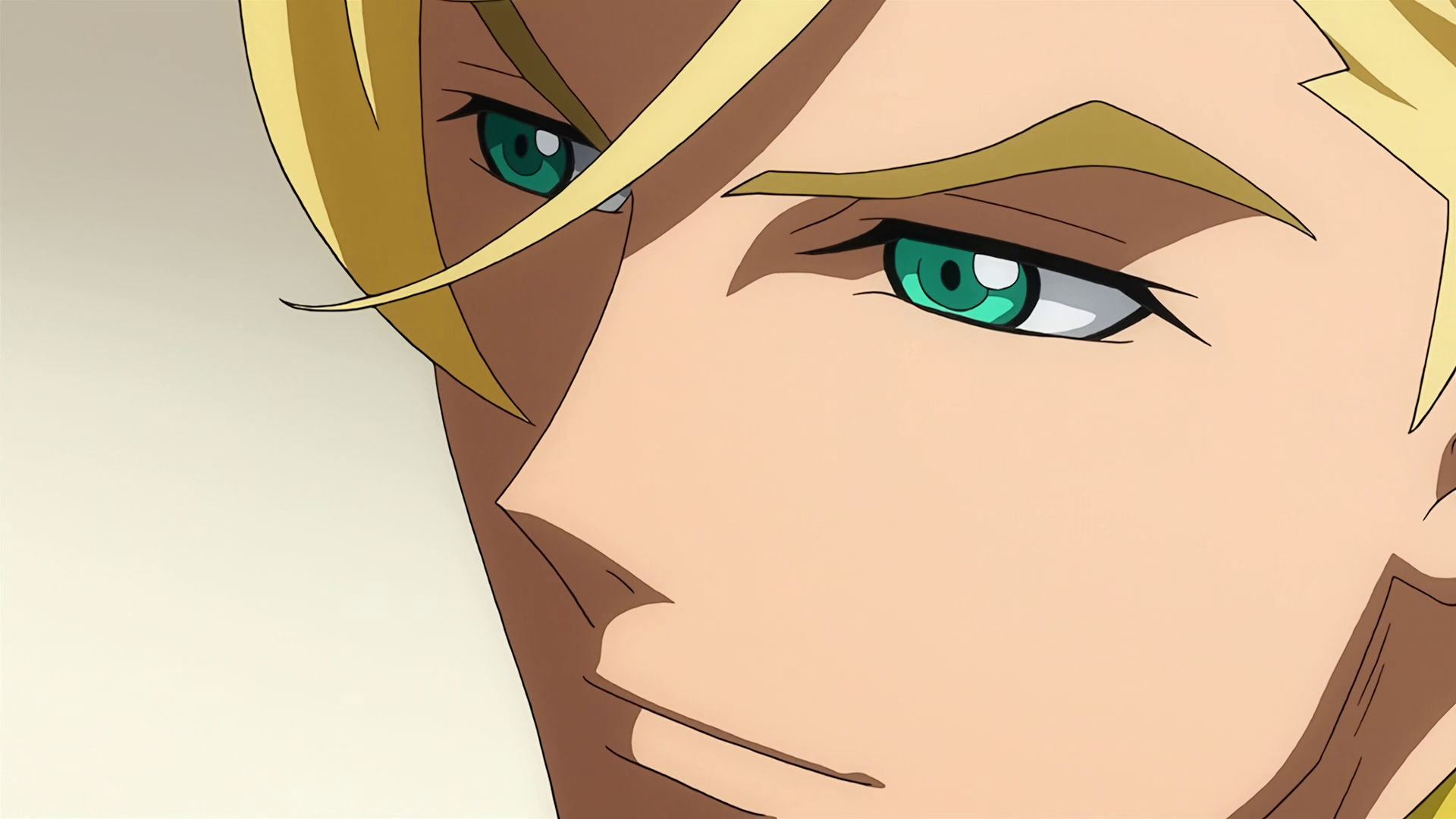 A closeup of McGillis face, he is smiling.