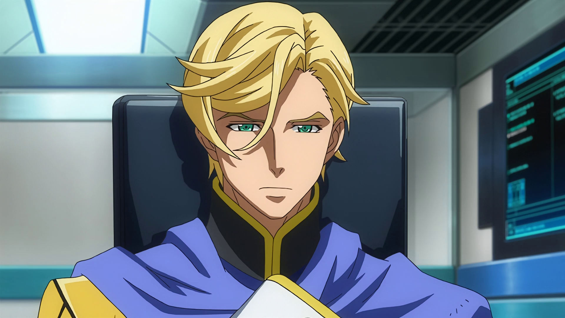 McGillis sitting on a chair with a serious expression on his face