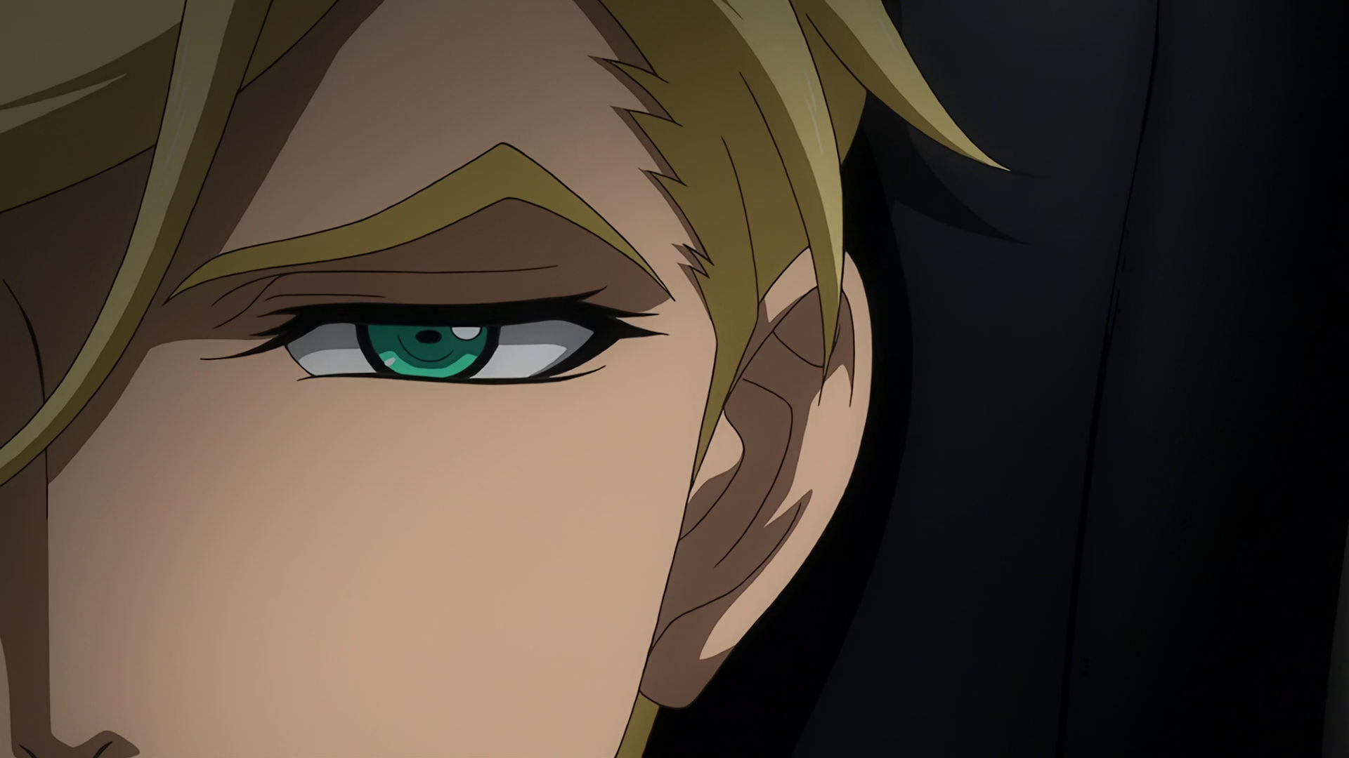 A closeup of McGillis' eye, only half his face is covering the left side of the frame